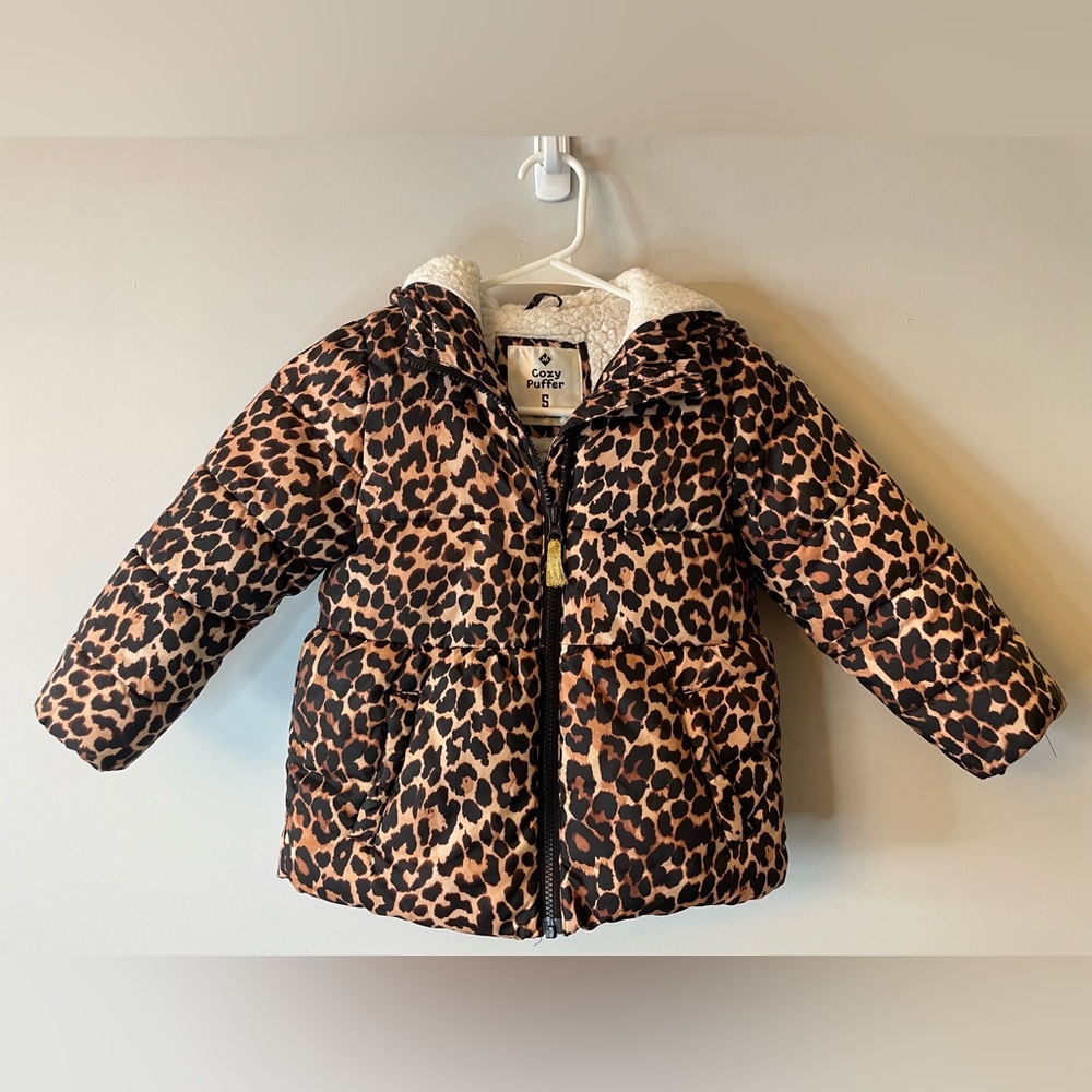 Girls Sherpa fleece lined puffer with peplum style body with Cheetah print.